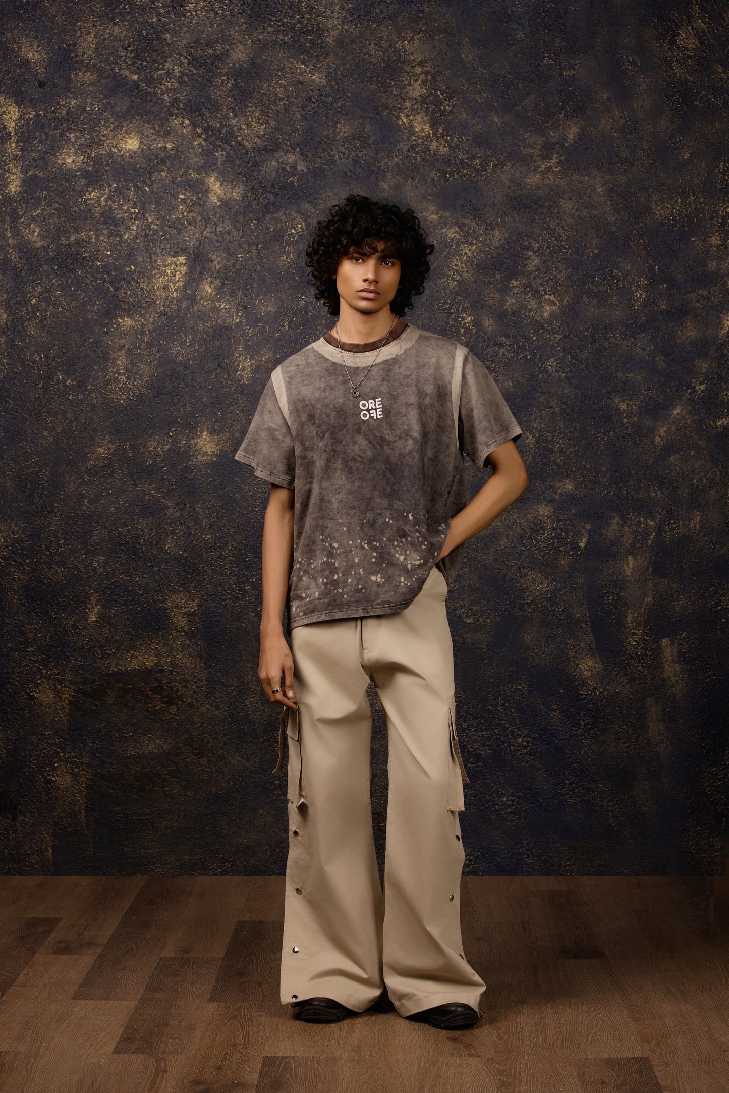 Model wearing the Premium Washed Oversized T-shirt with puffed print, made of 100% Terry Cotton.