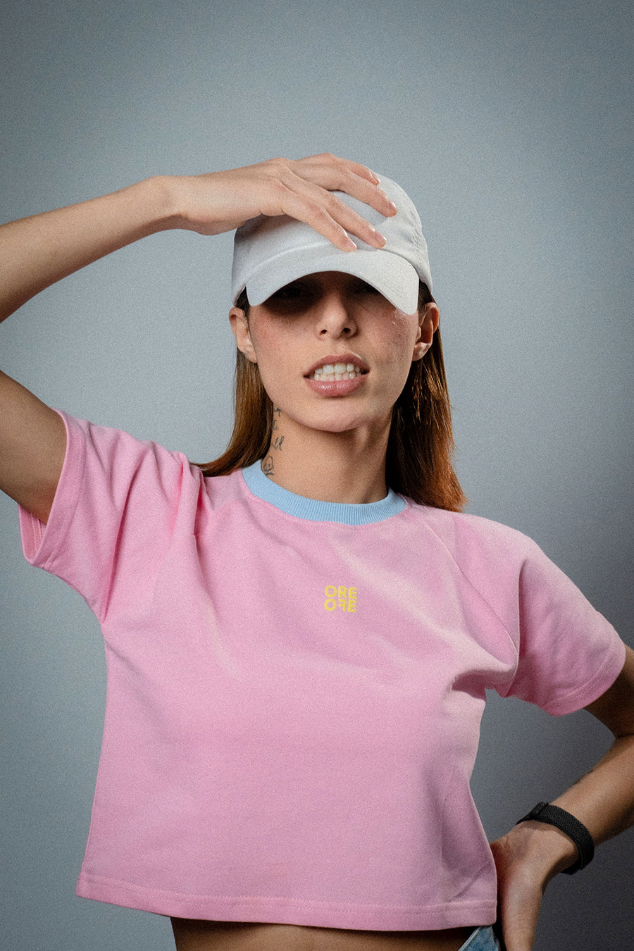 Female model wearing Pink basic crop top 