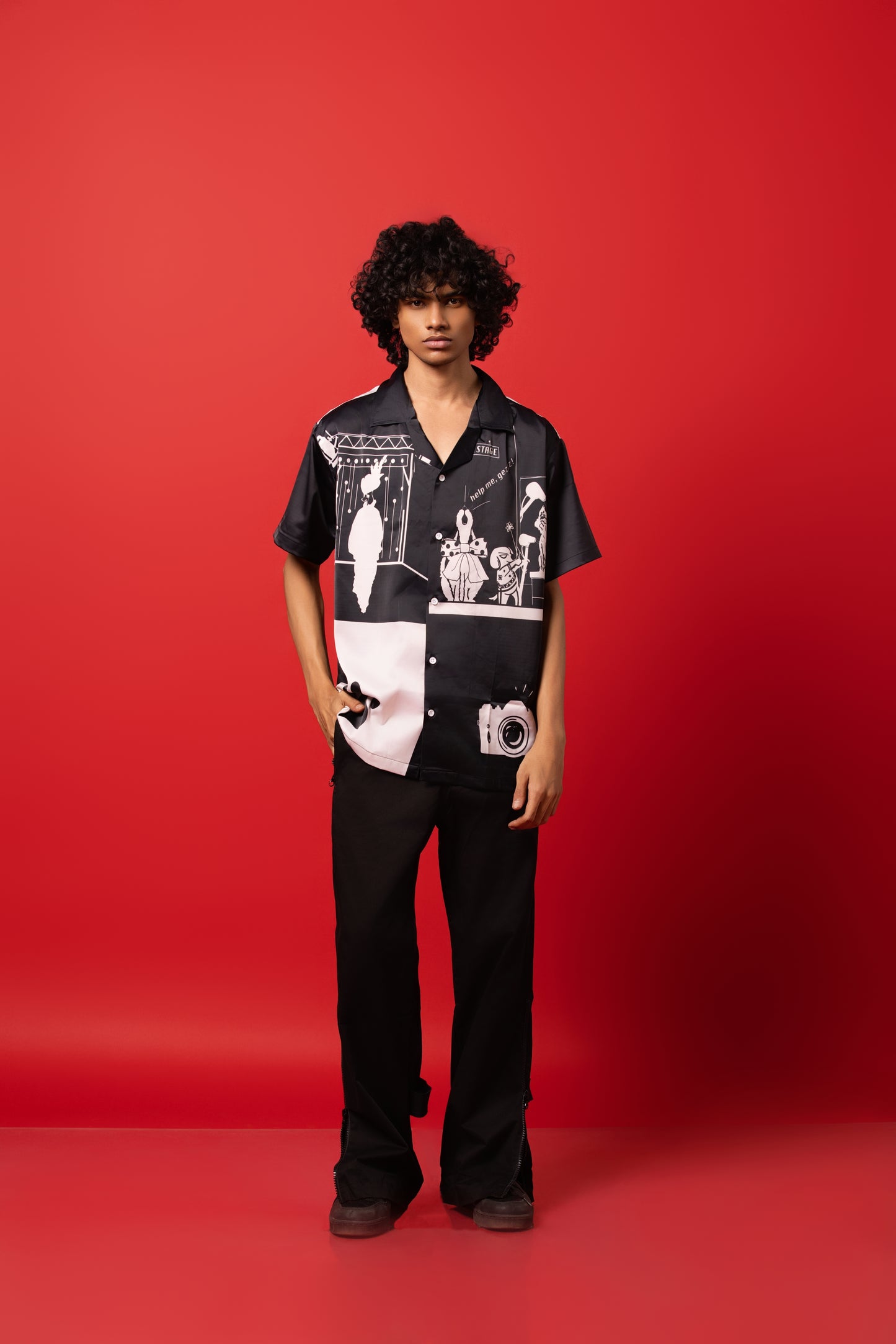 Model wearing the buttoned-down shirt made from Silk Satin, featuring a sublimation print.