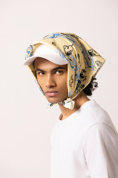 Model wearing the Surf Up Multi-purpose Bandana as a headband, featuring a surfing dog design, made from 100% cotton."