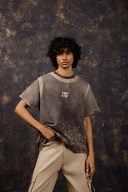 Model wearing the Premium Washed Oversized T-shirt with puffed print, made of 100% Terry Cotton.